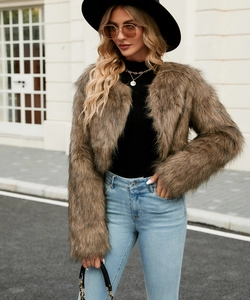 Detail of fluffy brown faux fur jacket texture and plush long-pile synthetic fiber material