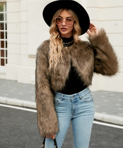 Close-up of brown faux fur jacket showing high-quality fluffy texture and street style