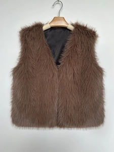 Detail shot of plush dark brown faux fur vest with V-neckline and glossy fibers