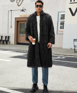 Full-body street style view of men's long faux fox fur coat in black with urban background
