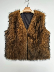 Detailed view of the V-neck faux fur vest with brown and black long shaggy fibers