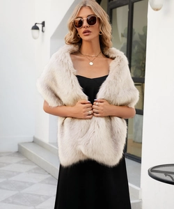 Close-up of elegant ivory faux fur shawl texture and stylish crossover wedding wrap style