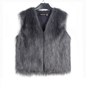 Detailed view of dark grey faux fur vest with V-neckline and smooth black inner lining