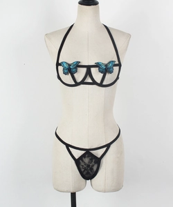 Detail of black sexy lingerie set with blue butterfly embroidery and lace thong