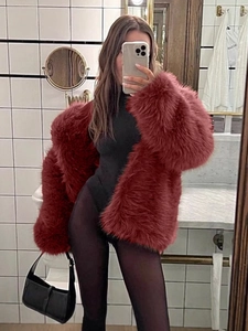 Elegant dark red faux fox fur coat in a mid-length winter style for fashionable women