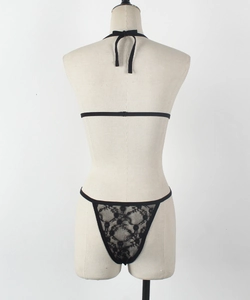 Rear view of black floral lace lingerie set featuring delicate straps and thong detail