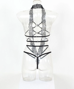 Detail of black lace lingerie with neck strap and intricate strap framework on back