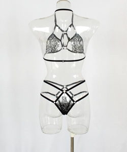 Detailed close-up of black lace bra featuring hollow cut-outs and metal ring hardware