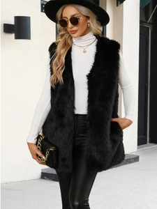 Close-up of the long black faux fur texture on this trendy sleeveless V-neck vest coat
