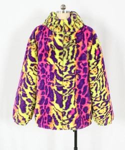 Detail of colorful purple and neon yellow faux fur leopard jacket with soft plush texture