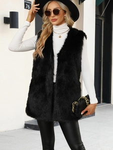 Detail of premium black faux fur vest showing texture and long sleeveless design