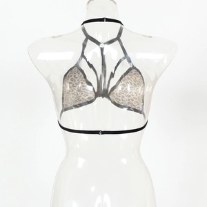 Detailed view of leopard print halter lingerie with multi-strap design and metal clasp