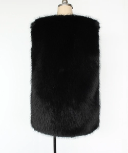 Back view of a long black faux fur vest with a soft shaggy texture and straight silhouette