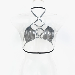 Détail du haut bustier noir métallisé avec bretelles croisées et finition brillante