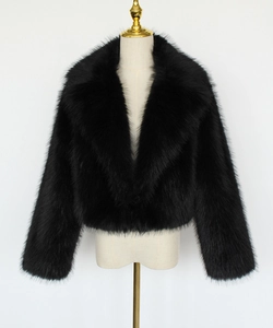 Detail of black faux fur jacket showing high-quality plush texture and wide lapel collar