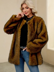 Detail shot of fluffy brown faux fur texture and long plush fibers on women's winter coat