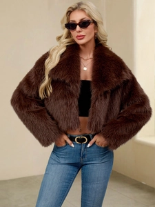 Detailed texture of dark brown faux fur jacket with lapel collar and fluffy finish