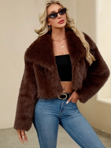Detail of the oversized collar and soft faux fur texture on a cropped brown jacket