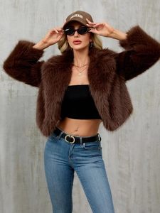 Close-up of a brown faux fur jacket with a soft texture and cropped open-front style