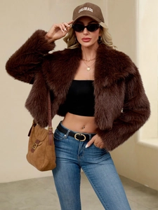 Close-up of thick brown faux fur texture and lapel design on short autumn jacket