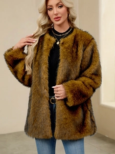 Detail view of soft brown faux fur coat texture with elegant gold layered necklace