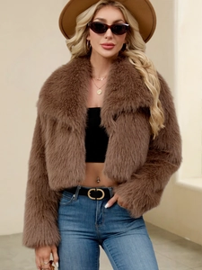 Close-up of brown faux fur short coat featuring a fluffy texture and large lapel design