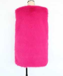 Back view of a long faux fur vest in vibrant rose pink on a display mannequin