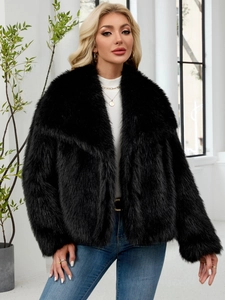 Close-up detail of plush black faux fur jacket texture with stylish wide lapel design
