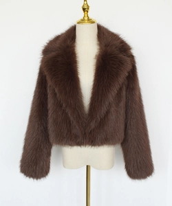 Close-up of brown faux fur short jacket with classic lapel collar for winter fashion