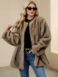 Detail of soft brown faux fur texture on a loose-fit long-sleeve winter coat for women