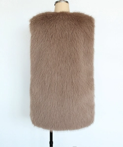 Detailed back view of a plush faux fur V-neck vest in tan with thick and fluffy long hair