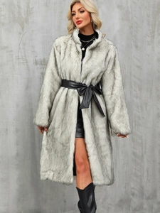 Detail of grey faux fox fur coat texture with elegant black leather bow belt
