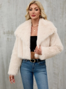 Detail of elegant faux fur lapel jacket in cream white with soft plush texture