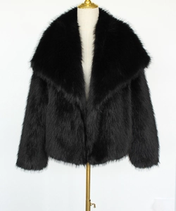 Front view of black short faux fur coat with wide shawl collar on a mannequin