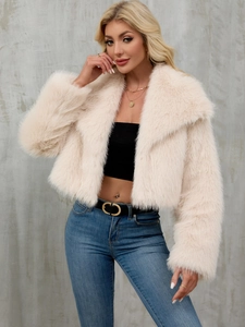 Detail of faux fur collar and plush texture on short light pink winter jacket