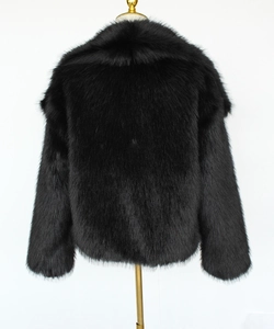 Rear view of a black short faux fur jacket showing thick high-density plush texture