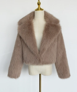 Detail of the oversized lapel and soft faux fur texture on this dusty pink short jacket