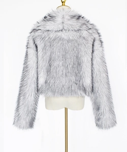 Detail view of the back of a short faux fur jacket with grey and white gradient fluffy texture