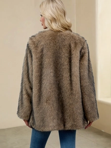 Rear view of long tan faux fur coat with fluffy texture and stylish loose fit