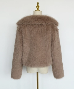 Macro detail of high-quality fluffy light brown faux fur jacket with soft texture
