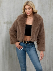 Detail of a brown faux fur jacket featuring a large notched lapel and fluffy texture