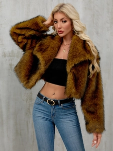 Close-up of fluffy faux fur texture on a cropped brown jacket with gradient tips