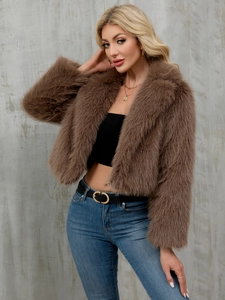 Detail of plush brown faux fur texture and lapel design on short cropped winter jacket