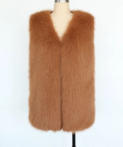 Detailed close-up showing texture of brown faux fur vest with deep V-neck and long plush pile