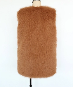 Close-up detail of plush caramel faux fox fur texture on a sleeveless longline vest