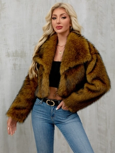 Detail of faux fur coat featuring a wide collar and lush brown black texture