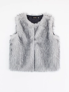 Detailed view of grey faux fur vest with soft texture and black inner lining and label