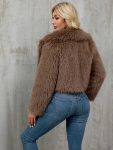 Detailed texture of thick brown faux fur on a stylish short jacket from a side back view