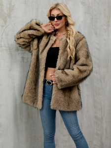 Detailed texture of mid-length faux fur coat with brown and black highlights