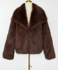 Detailed view of the dark brown faux fur jacket showing the fluffy plush texture and collar